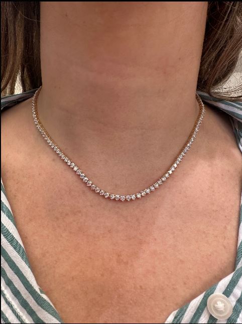 18K Yellow Gold Diamond Tennis Necklace worn by a woman with a striped garment