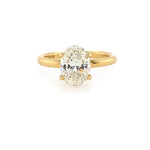 18K Gold ring with a large diamond on a white background
