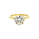 18K Gold ring with a large diamond on a white background