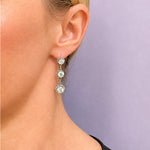 18K white gold 3 stone old mine diamond earrings on model