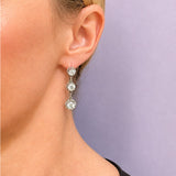 18K white gold 3 stone old mine diamond earrings on model