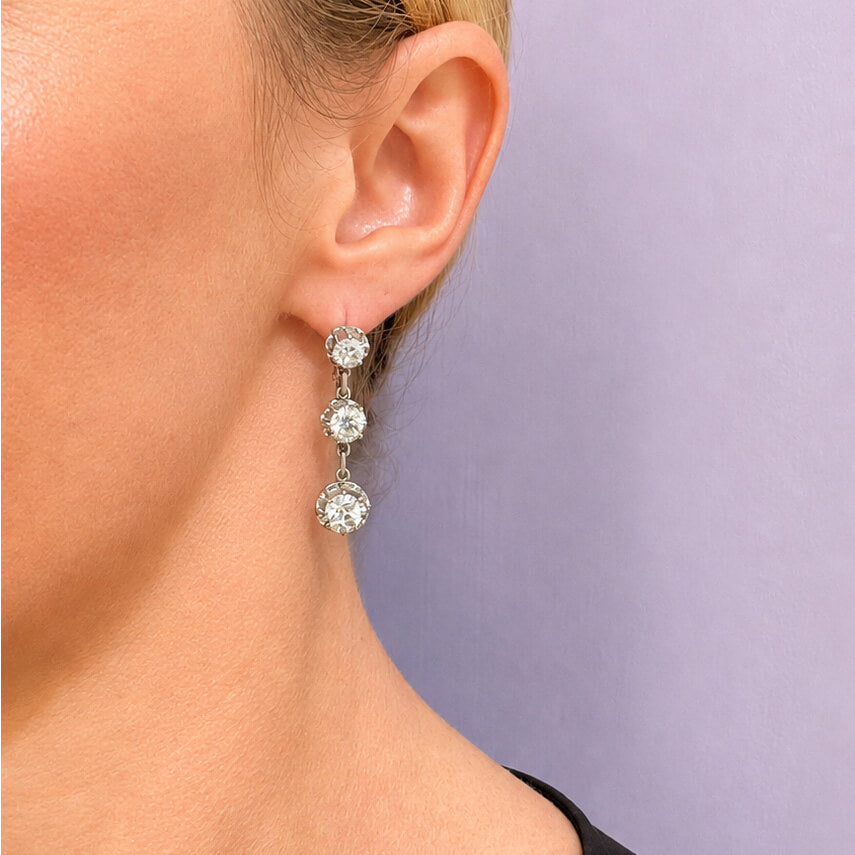 18K white gold 3 stone old mine diamond earrings on model