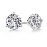 A pair of 18K white gold martini set diamond stud earrings.