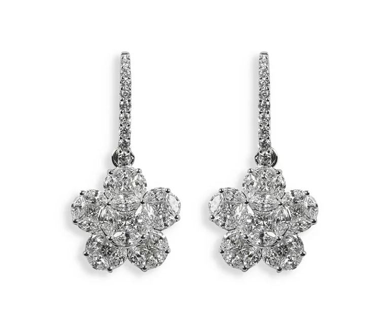 A pair of 18K white gold mosaic diamond flower drop earrings.
