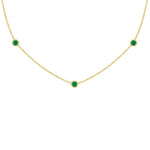 18K yellow Gold necklace with emerald green gemstones on a white background