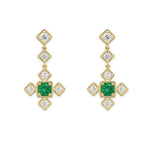 18K Gold earrings with green emerald gemstones and clear diamonds on a white background