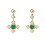 18K Gold earrings with green emerald gemstones and clear diamonds on a white background