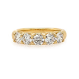 18K Gold ring with five diamonds on a white background