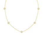 An 18K yellow gold necklace featuring a series of daisy flower stations with full diamond accents, presented against a white background.