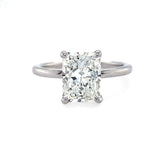 An 18K white gold radiant cut diamond ring with a G-H SI2 GIA certification, displayed on a white background.