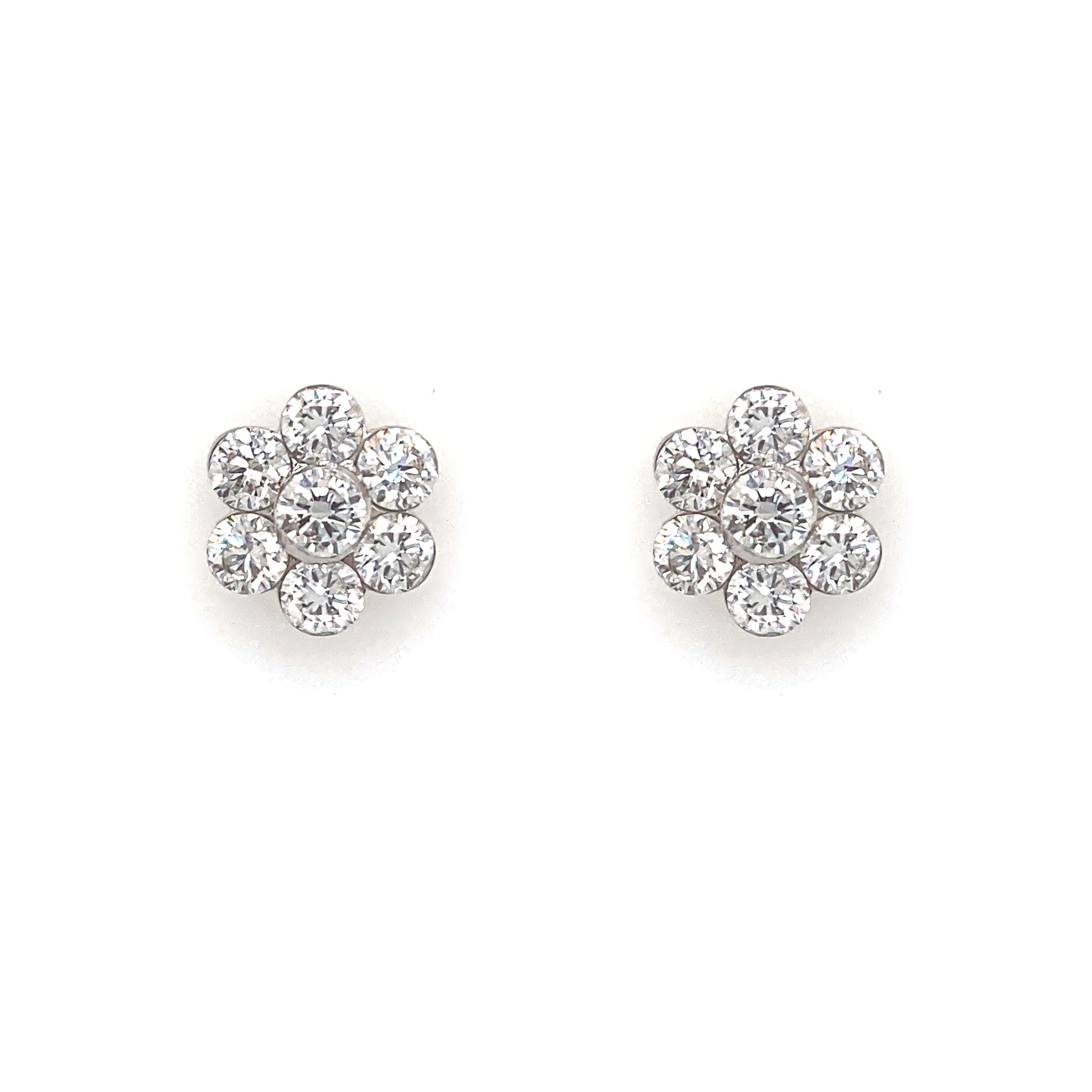 A pair of 18K white gold diamond flower earrings.
