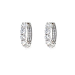Pair of 18K White Gold diamond hoop earrings on a white background