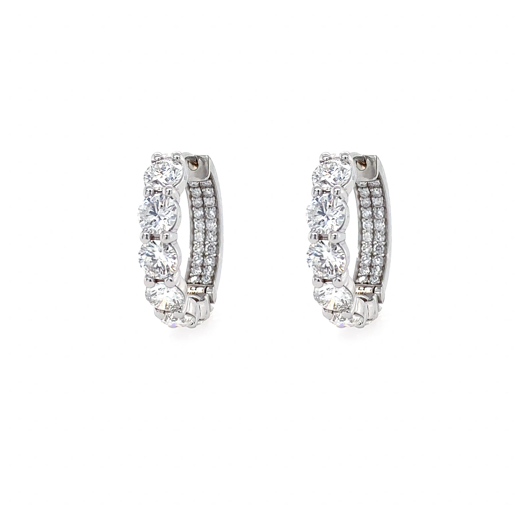 Pair of 18K White Gold diamond hoop earrings on a white background