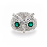 18K White Gold owl-shaped ring with Emerals and Diamonds on a white background