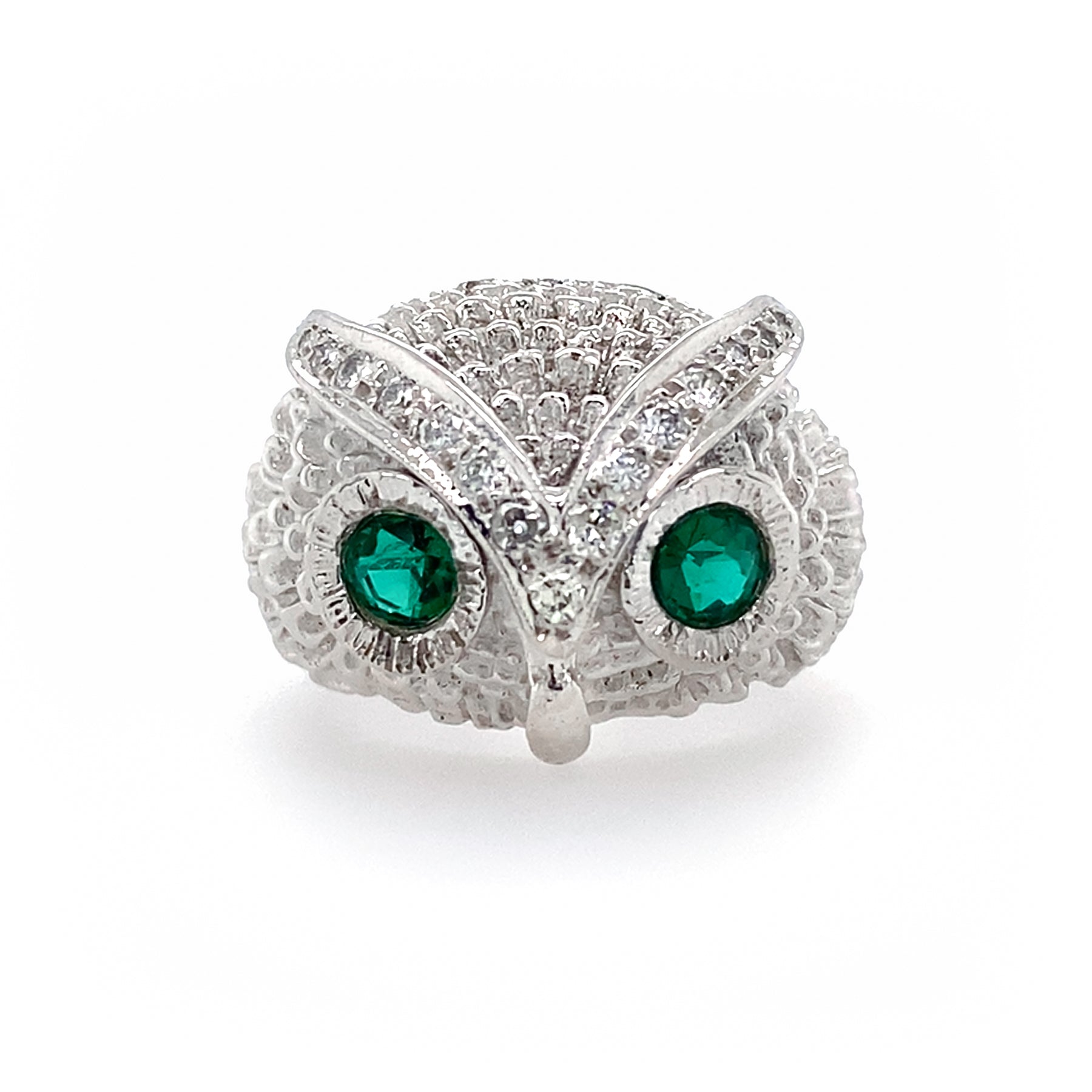 18K White Gold owl-shaped ring with Emerals and Diamonds on a white background