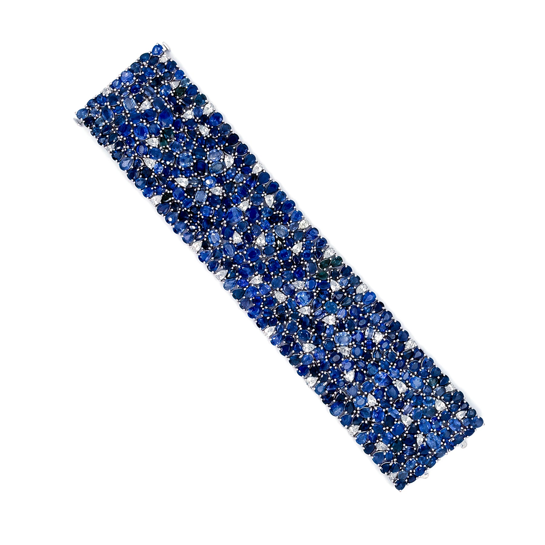 An 18K white gold bracelet with a series of blue sapphire stones set alongside white diamonds, creating a pattern of sorts.