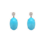A pair of 18K white gold turquoise drop earrings with diamonds.