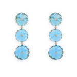 A pair of 18K yellow gold dangle earrings featuring blue topaz flowers with diamond accents.