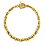 An 18K yellow gold chain necklace with a textured, rope-like twisted design and a matching toggle clasp, shown on a plain white background.