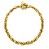 An 18K yellow gold chain necklace with a textured, rope-like twisted design and a matching toggle clasp, shown on a plain white background.