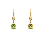 18K Gold drop earrings with green Peridot gemstones  on a white background