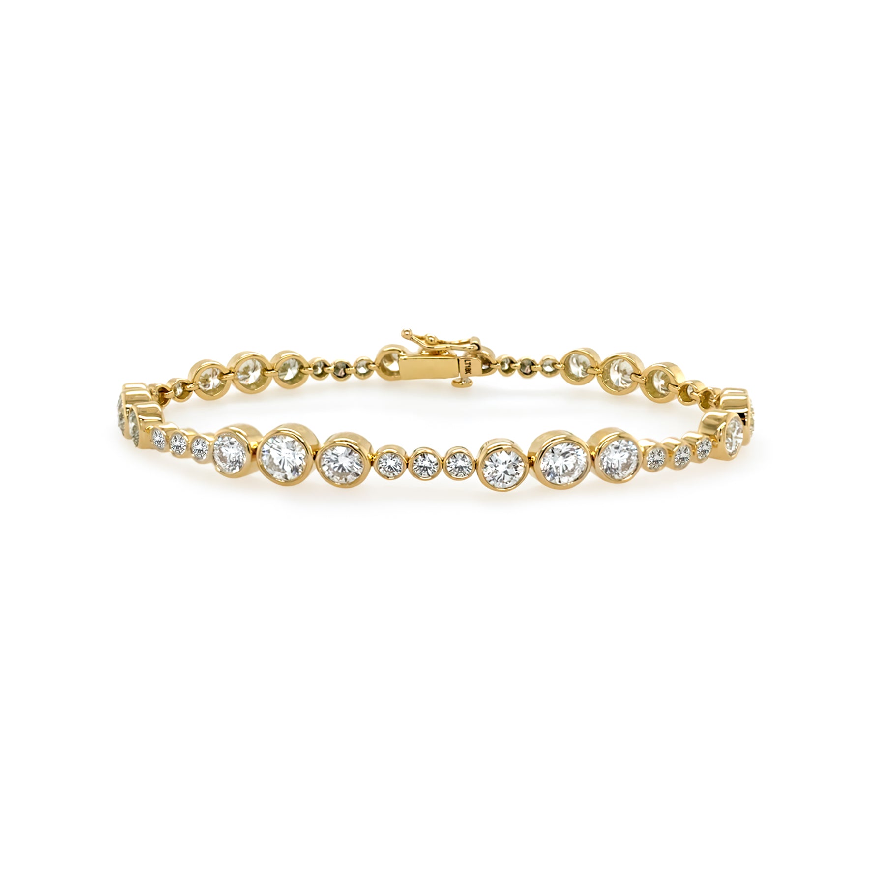 An 18K yellow gold tennis bracelet with diamond bezels evenly spaced along its length.