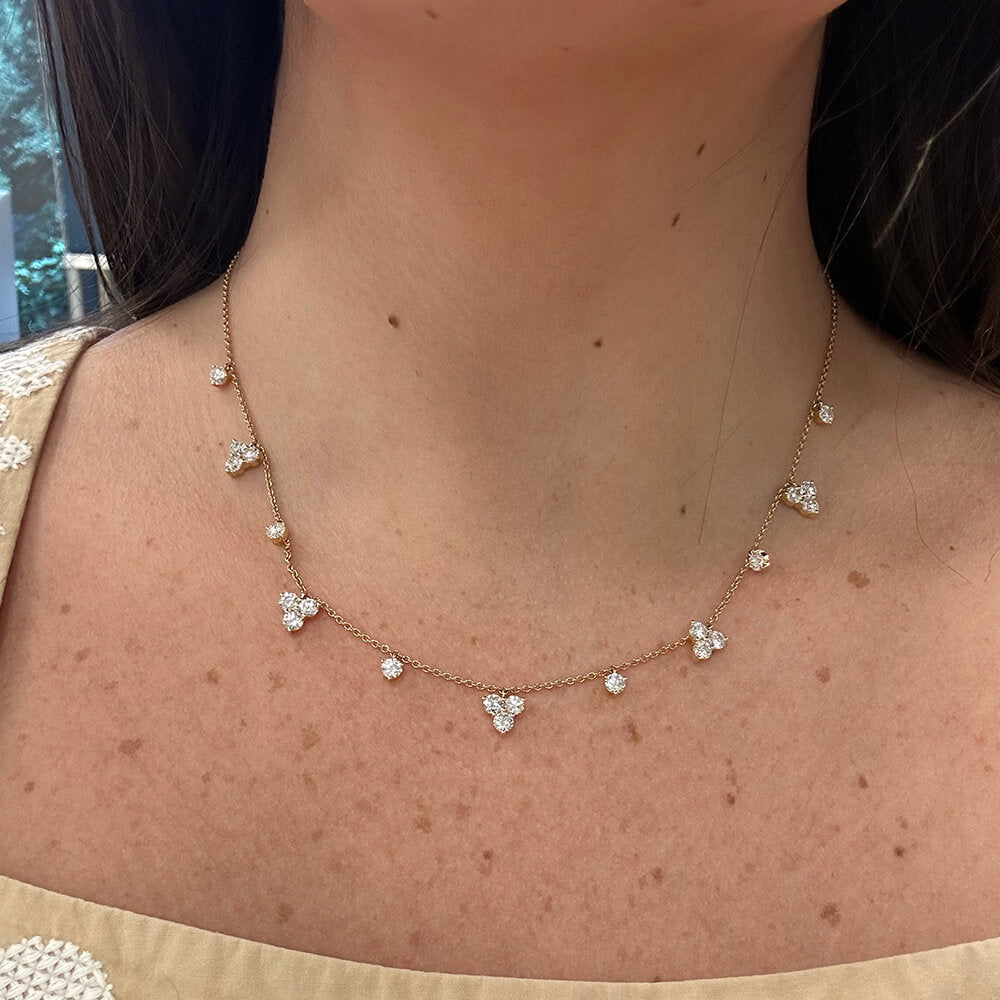 Woman wearing 18K gold Diamond Station necklace