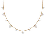 18K Gold necklace with diamond pendants on a white background