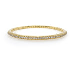18K Gold stretch bracelet with diamonds on a white background