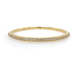 18K Gold stretch bracelet with diamonds on a white background