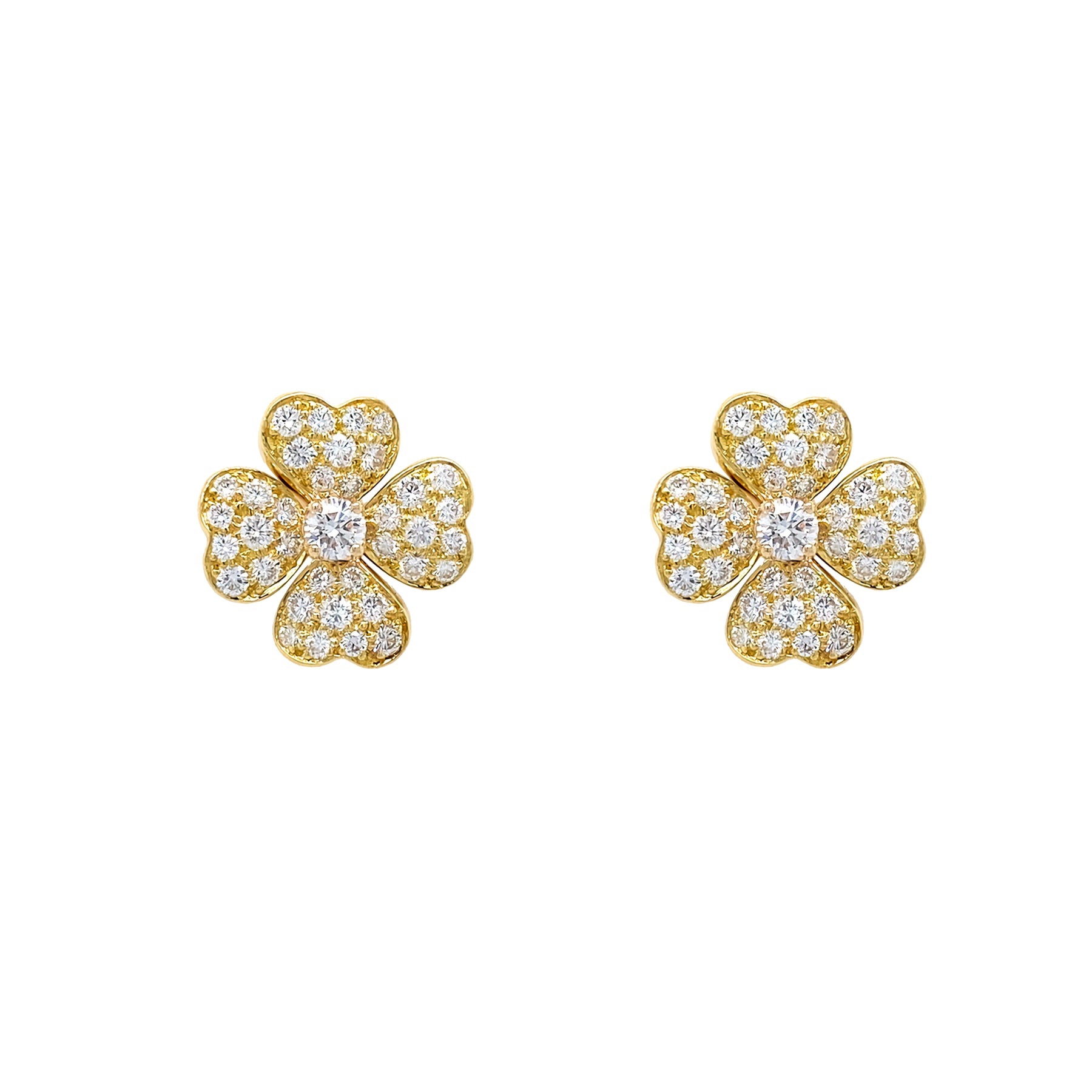 18K Gold clover-shaped earrings with diamond accents on a white background