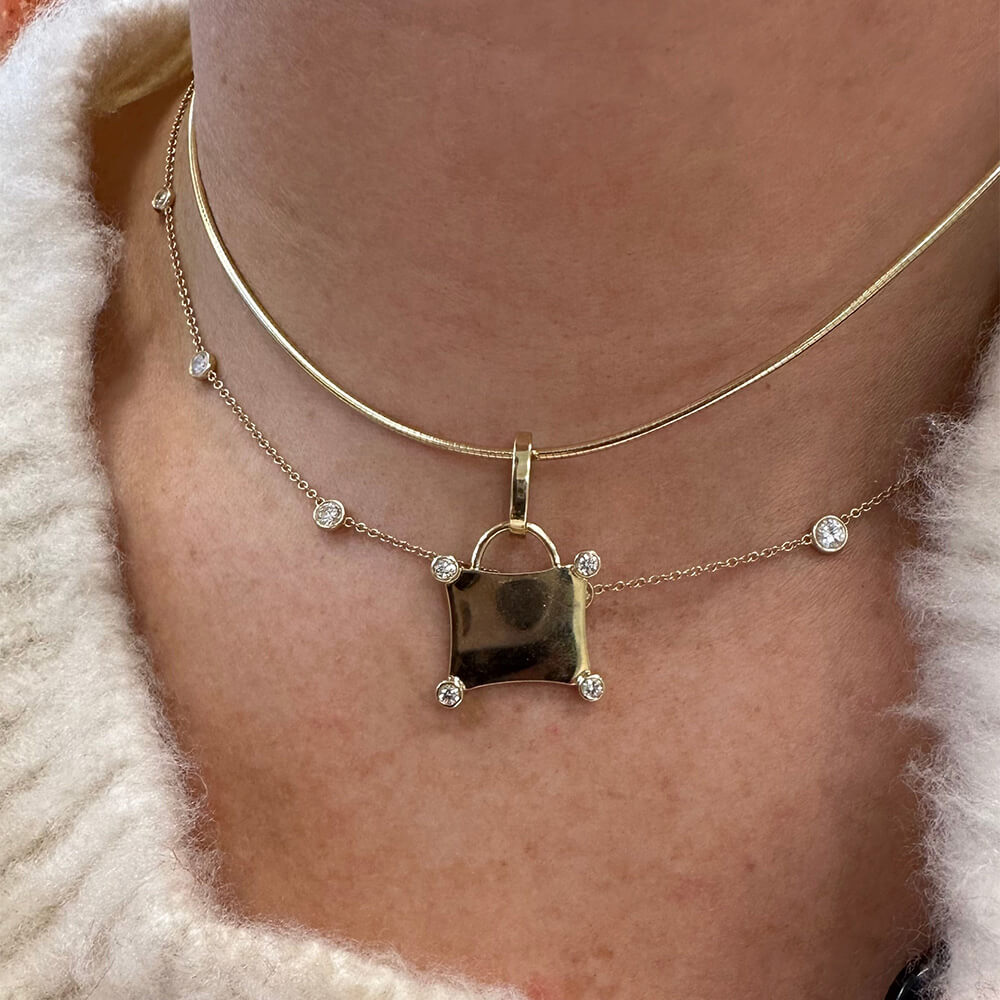Gumuchian Calendar Charm on model