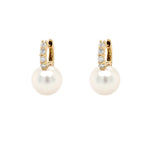 Pair of pearl earrings with diamond accents on a white background