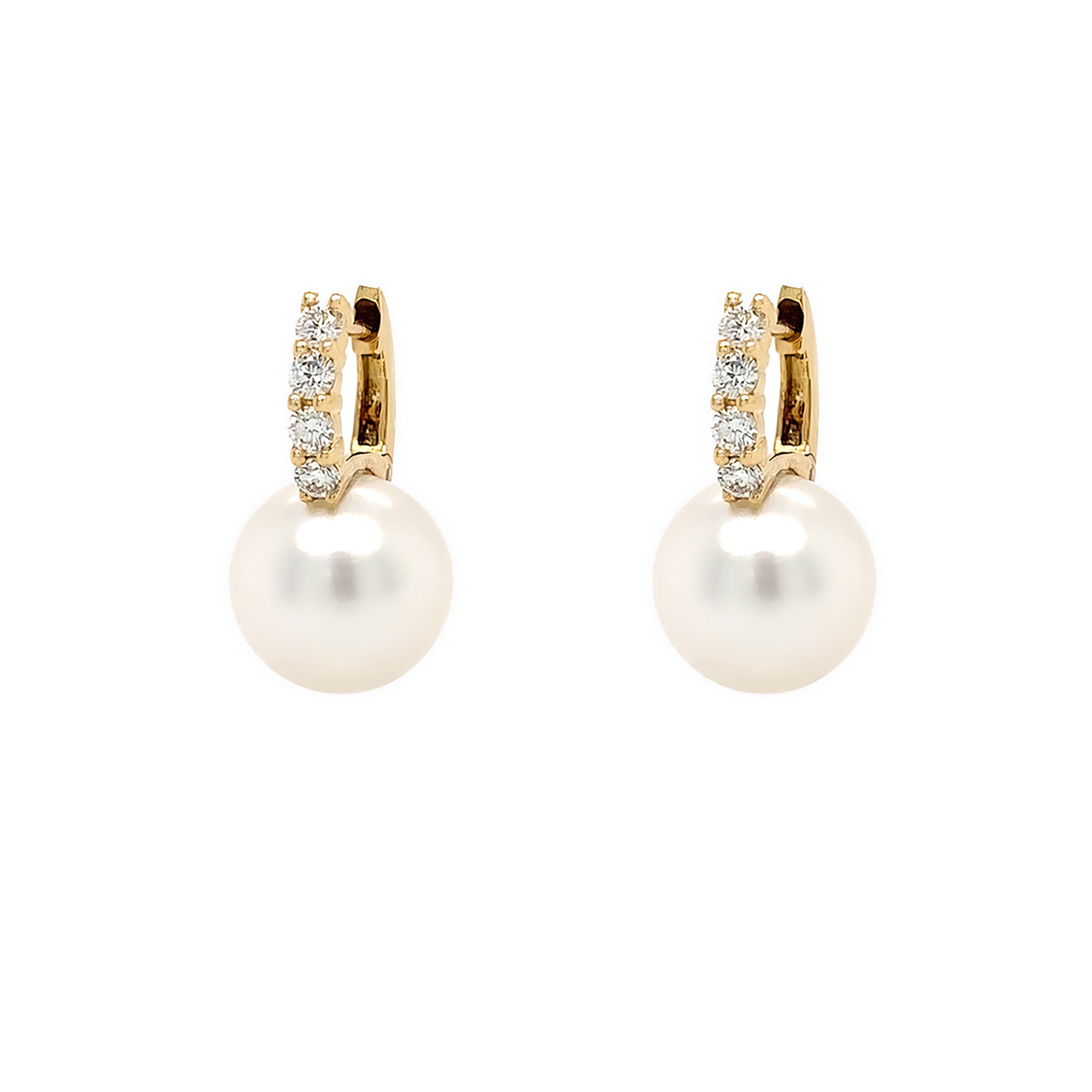 Pair of pearl earrings with diamond accents on a white background