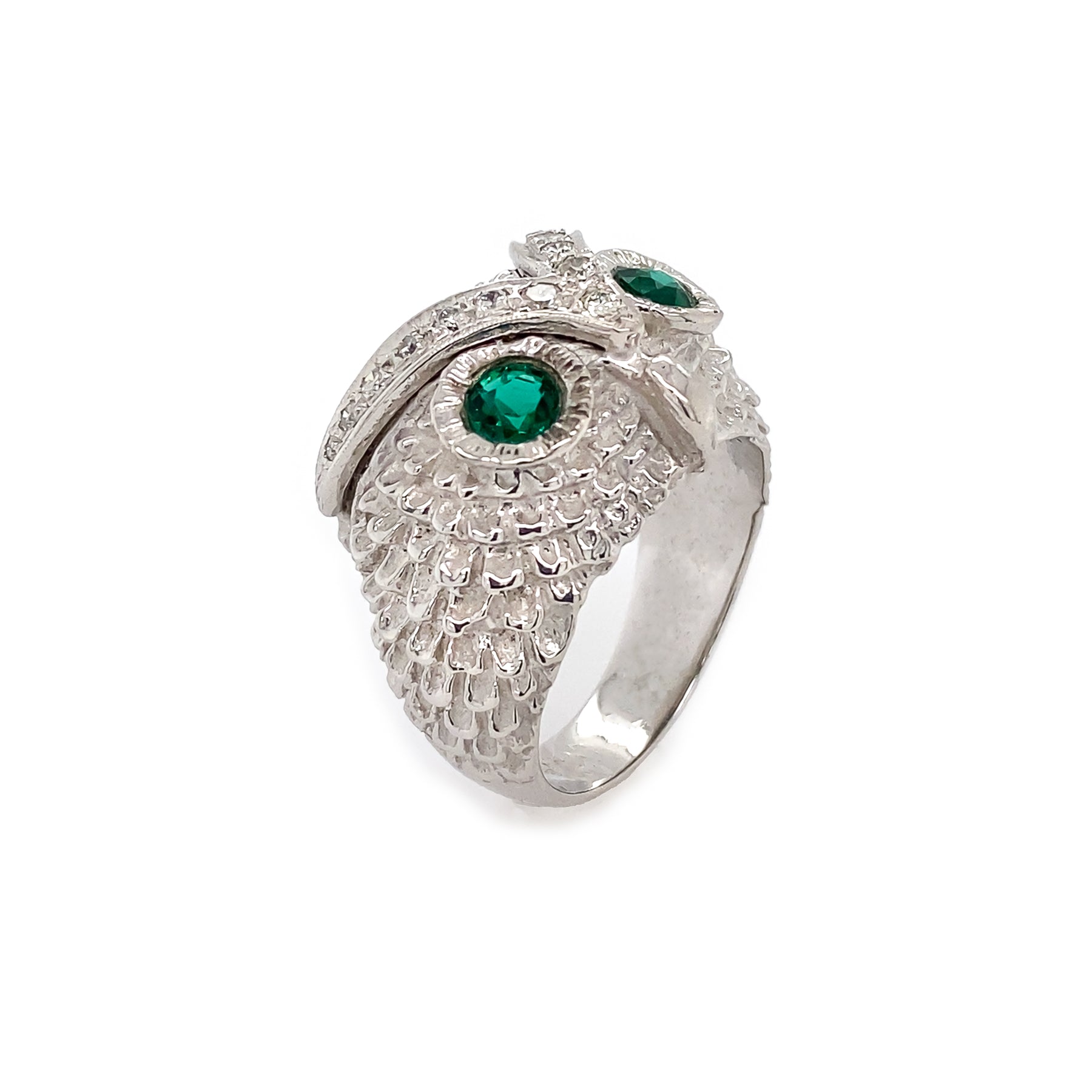 18K White Gold Owl ring with emeralds on a white background