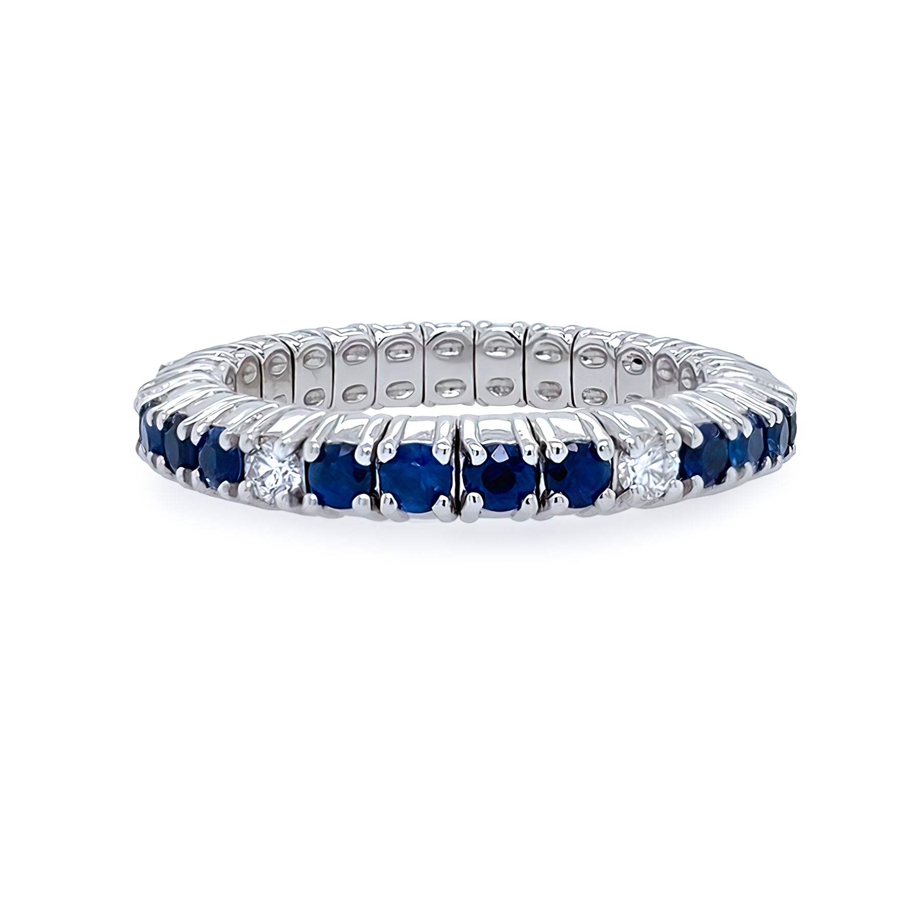 Eternity ring with blue sapphires and diamonds on a white background