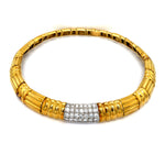 Gold bracelet with a diamond accent on a white background