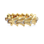An Estate 18K yellow gold diamond bracelet with multiple linked bands and diamonds.