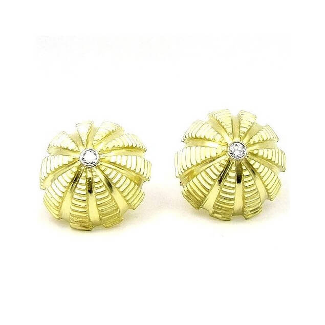 A pair of 18k yellow gold dome-shaped earrings with a single diamond set in the center, on a white background.