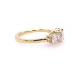Side view of 18K gold ring with 3 diamond stones