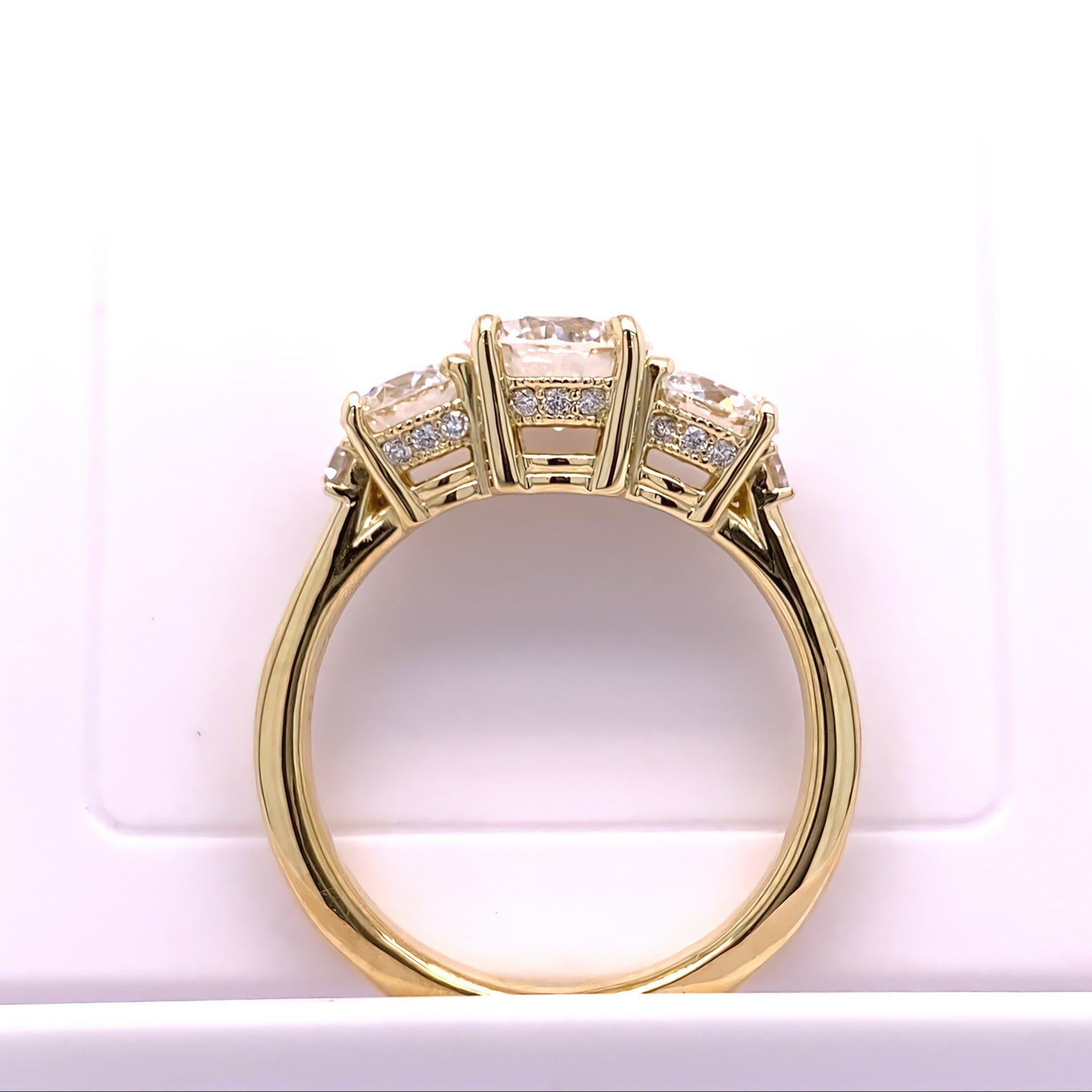 Alternate view of 18K gold ring with three diamond stones 