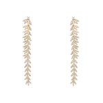18K Gold earrings dangle with a leaf-like design on a white background