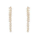 18K Gold earrings dangle with a leaf-like design on a white background