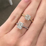 woman wearing 18k gold diamond solitaire rings