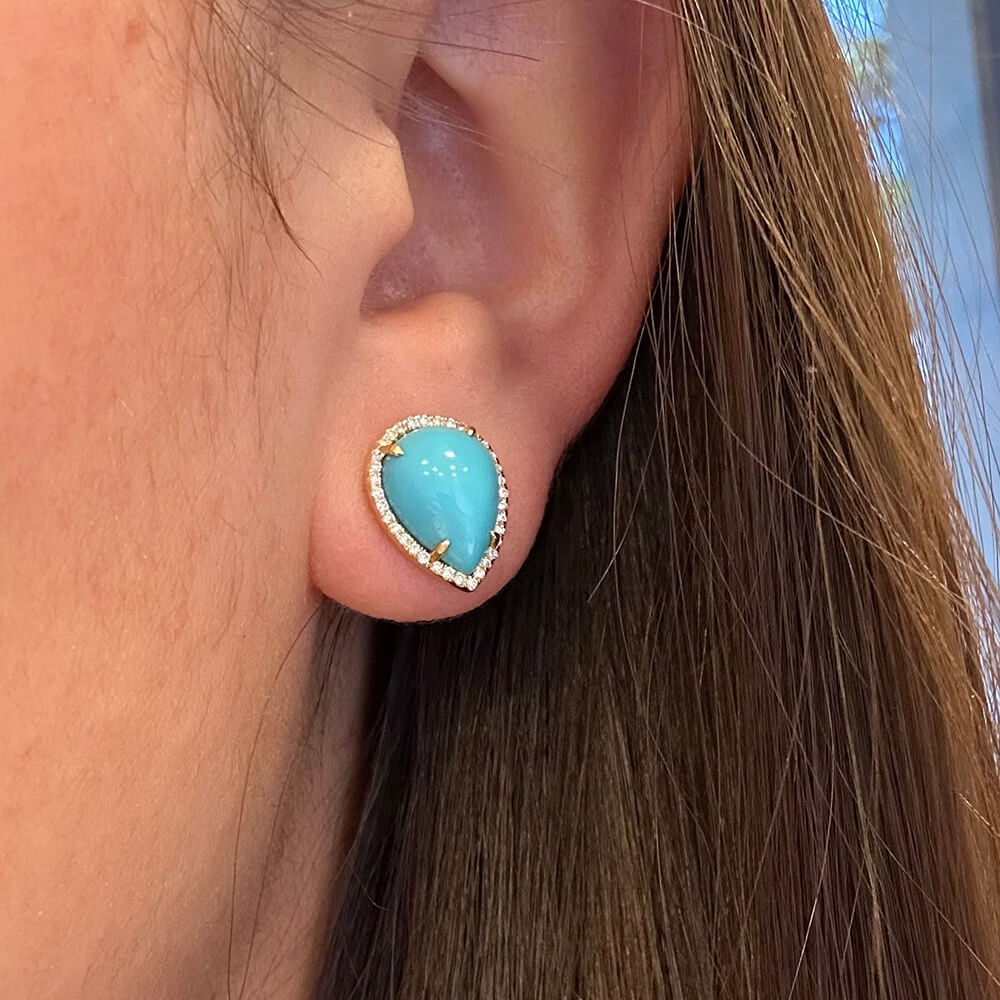 18K gold Turquoise earring with pave diamonds worn by a woman with brown hair.