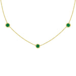 18K Gold necklace with green emerald gemstones on a white background