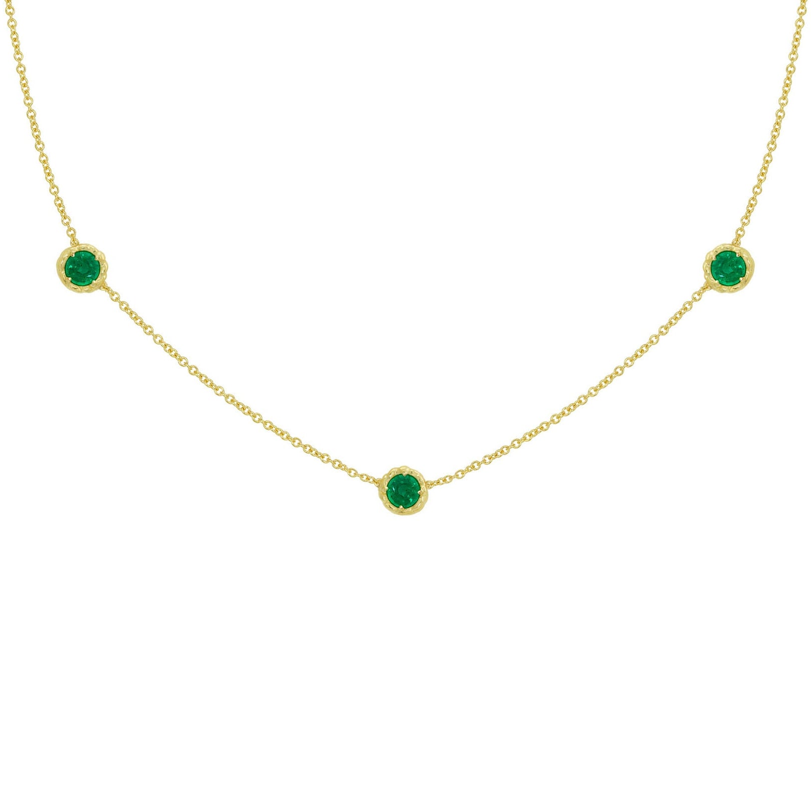 18K Gold necklace with green emerald gemstones on a white background