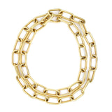 An 18K gold chain necklace with large, elongated oval links, arranged in a loose double circle on a plain white background.