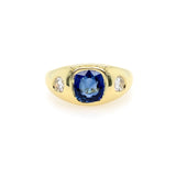 front view yellow Gold ring with a blue sapphire and diamond side stones