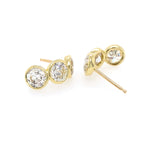 Custom designed 18K Gold earrings with bezel set diamonds